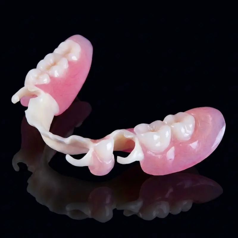 Premium metal-free partial dentures with clear clasps, engineered by the Confidentures clinical team in Silverdale for a seamless, natural smile.